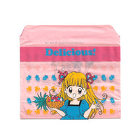 small pink bag featuring an image of an anime girl with a pineapple and other fruit from the 90s manga Delicious!