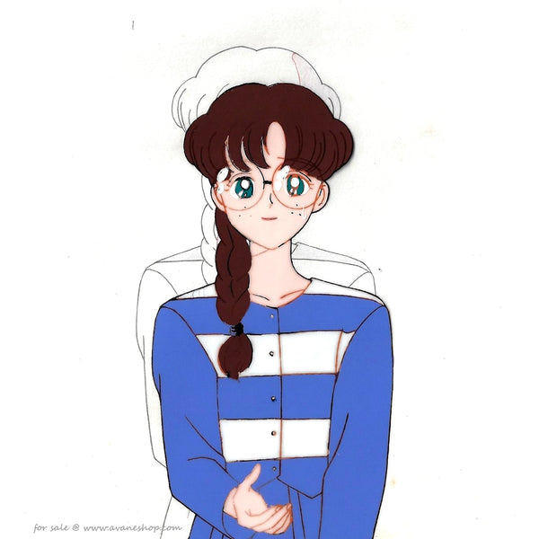 Han Painted anime cel from Sailor Moon. This is Yumemi Yumeno from episode 28, a girl with long brown braided hair, pale skin and glasses. She is wearing a blue and white striped shirt.