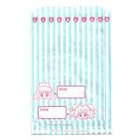 Blue and white striped paper bag with a manga illustration of the popular japanese licca doll. Art drawn by Mia Ikumi who was best known for creating Tokyo Mew Mew.