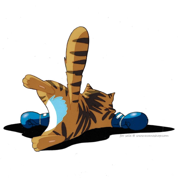 Hand painted anime cel from Urusei Yatsura. This is an anime cel of Torajima, an orange cat with brown stripes and blue boxing gloves laying face down.