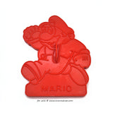 Vintage red plastic cookie cutter in the shape of mario  from the super mario brothers games